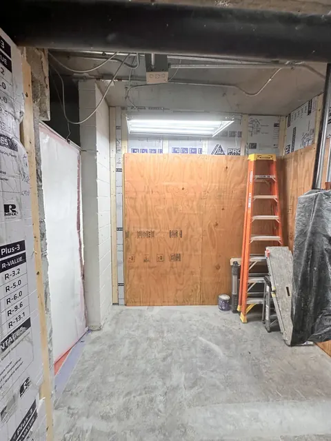 A service room lined in plywood.